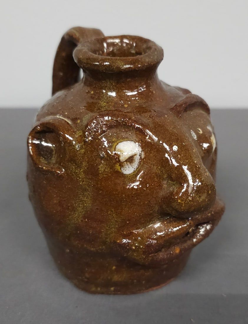 Lot 172: Early Crude Marie Rogers Face Jug
