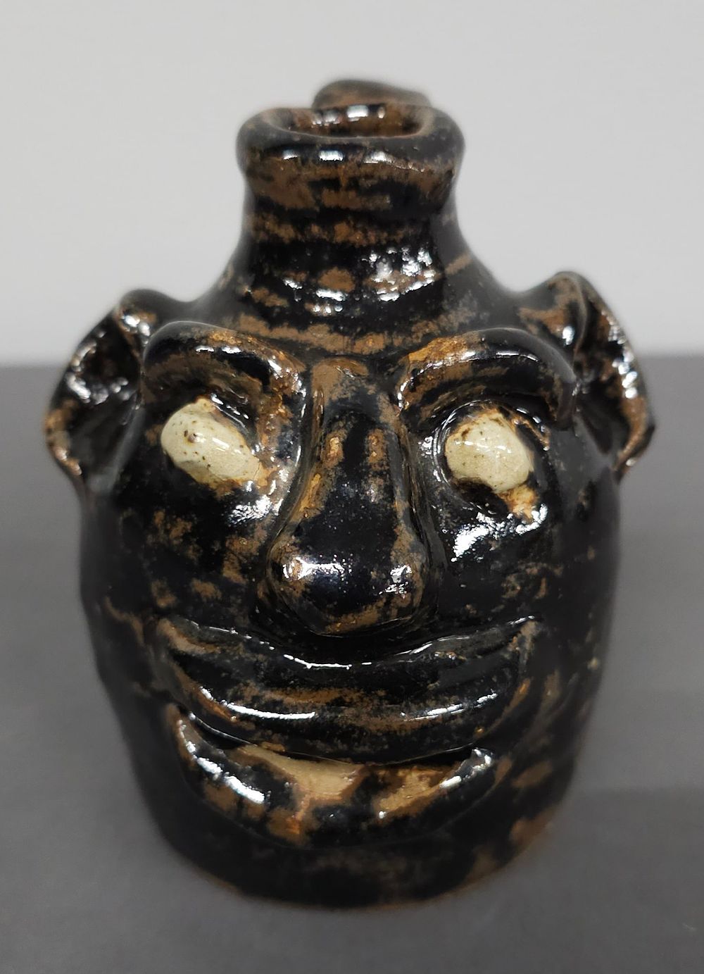 Lot 173: Early Marie Rogers Face Jug