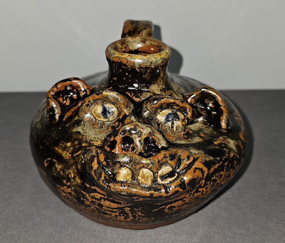 Lot 176: Fine Marie Rogers Face Buggy Jug