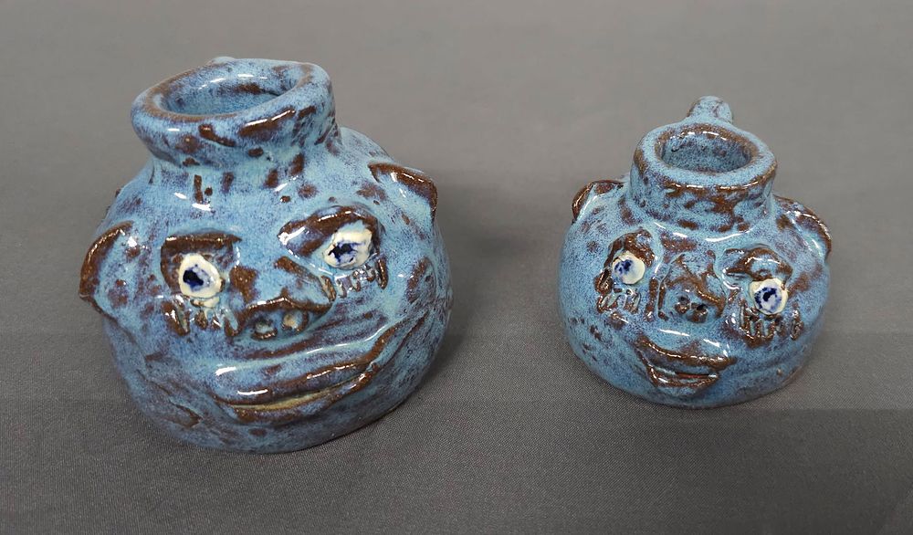Lot 179: Marie Rogers Blue Mini Face Jars Lot