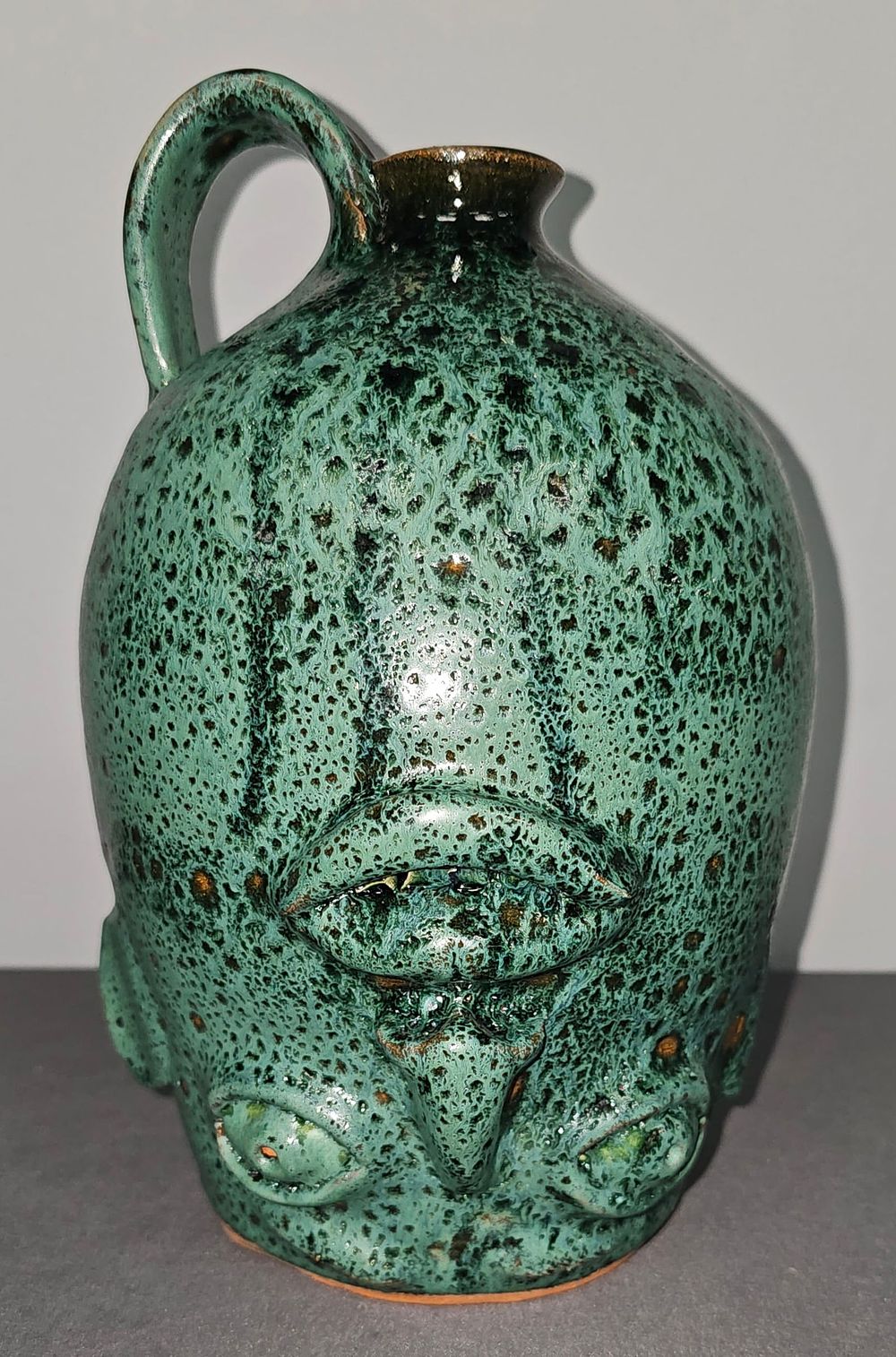 Lot 186: Fine Charlie West Upside Down Face Jug 1999
