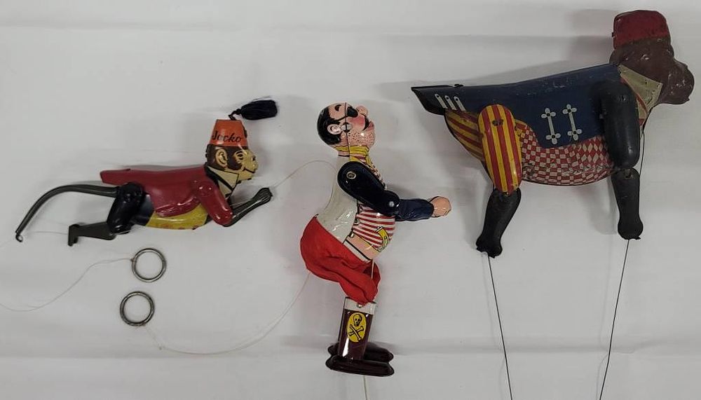 Lot 220: 1950's Japan Tin Litho Climber Lot of Three