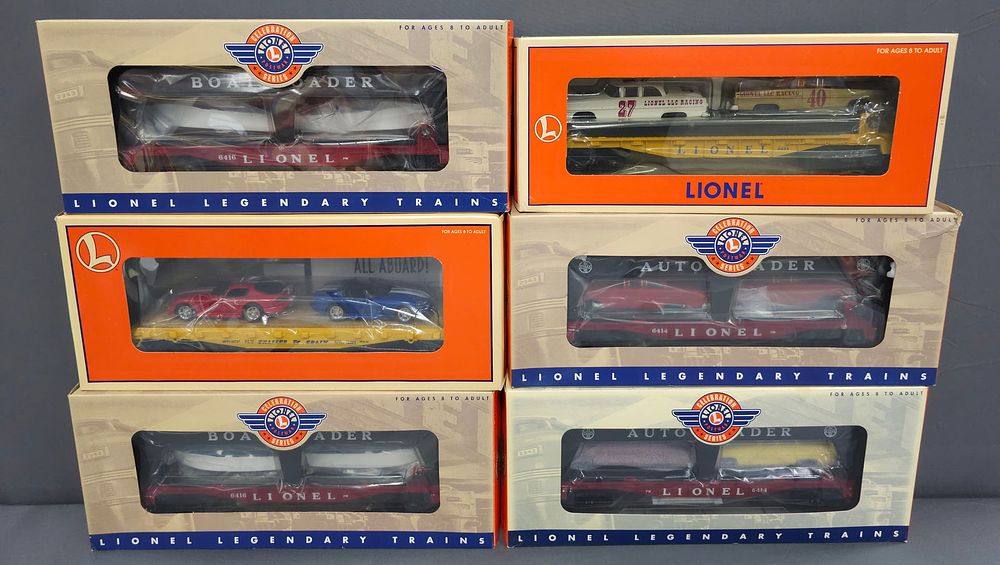 Lot 218: Lionel Auto Carrier & Boat Loader Lot of 6 (NIB) Lionel Auto Carrier & Boat Loader Lot of Six Cars