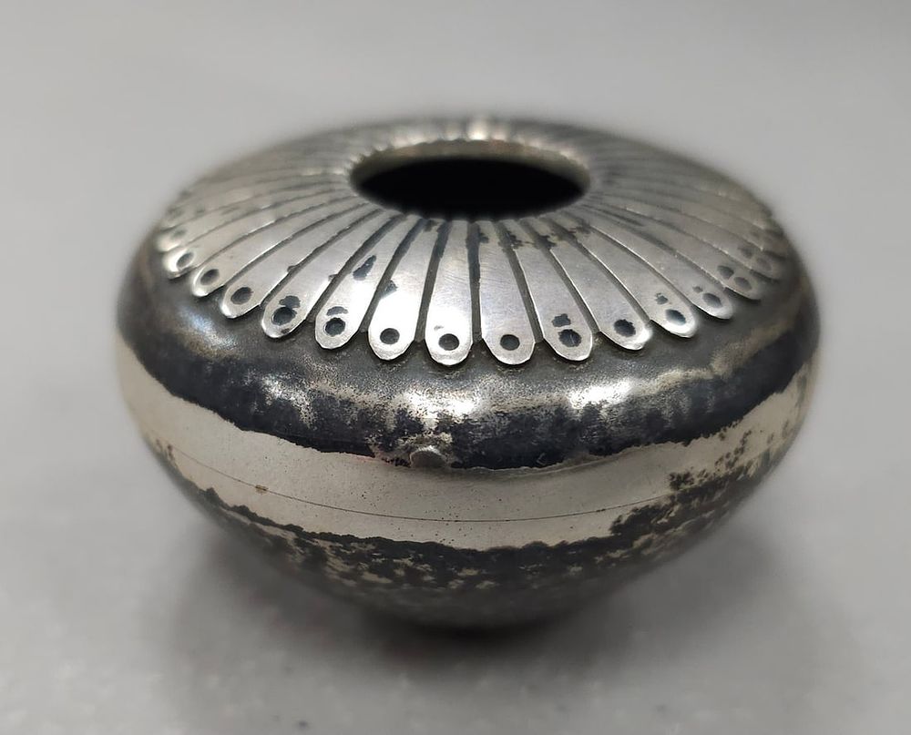 Lot 336: Norbert Peshlakai Sterling Pot With Feather Design