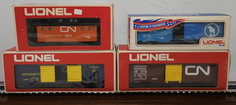 Lot 147: Lionel Boxcar/Caboose/ Automobile BC Lot of Four