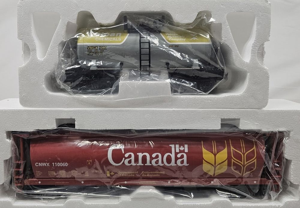 Lot 245: MTH Canada 4-Bay Grain Hopper & Vulcan Tank Car