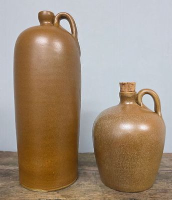 W J Gordy Single-Handle Jugs Lot of 2. Both are in Mountain Gold glaze and signed on the 