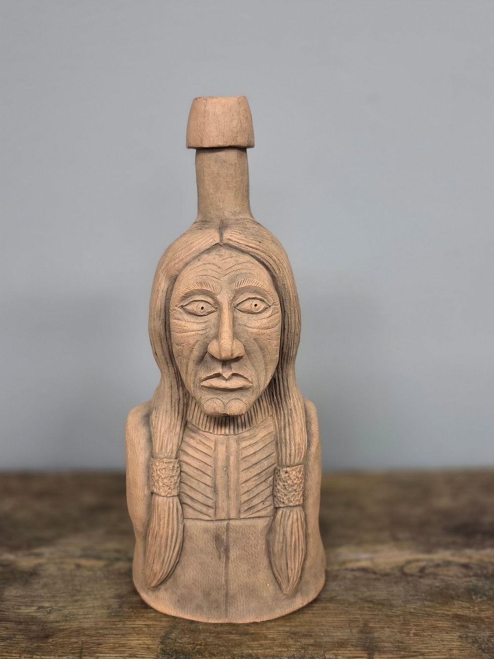 Lot 12: Swany Cornett "Chief Sitting Bull" Face Bottle