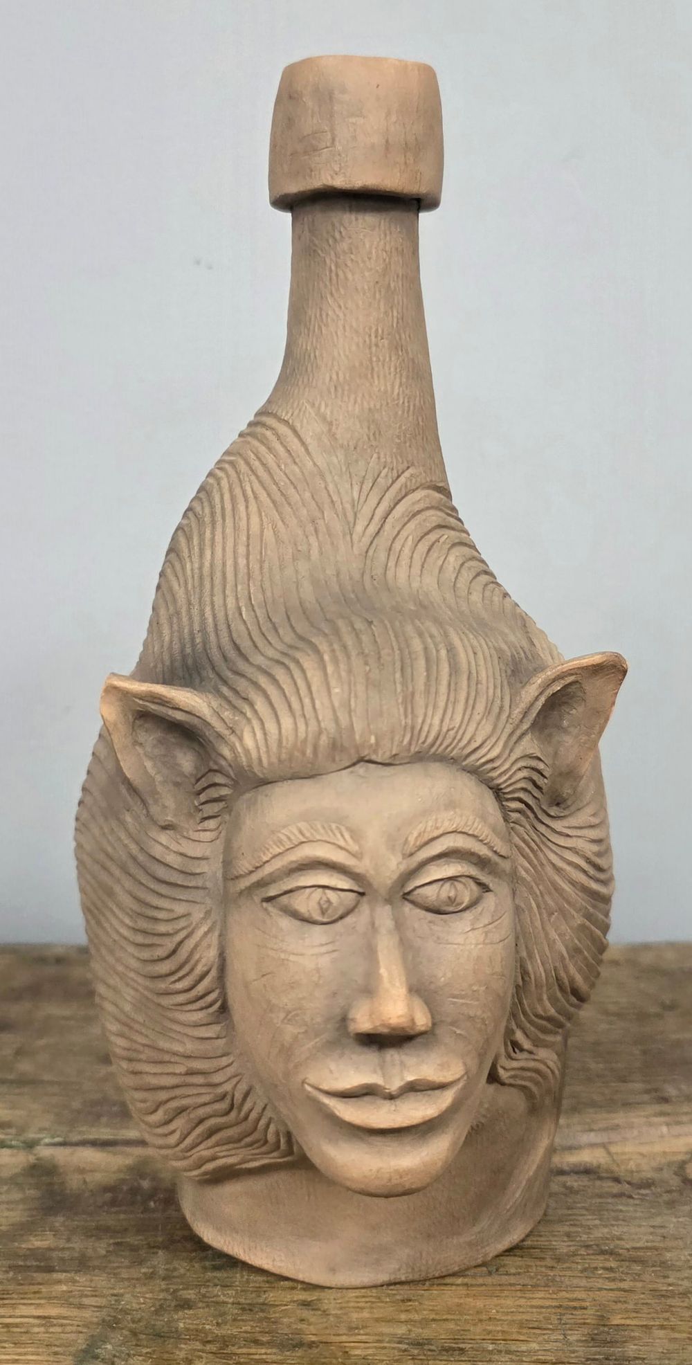 Lot 14: Swaney Cornett Native American Spirit Face Bottle