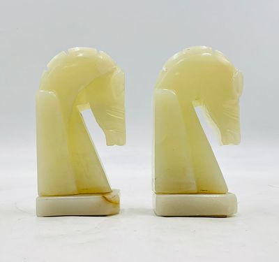 Pair of Vintage Hand-Carved Onyx Horse Head Bookends in the Style of Chess Knights. A charming 