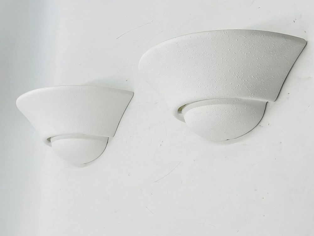 Pair of Modern White Ceramic Wall Sconces. Sleek and minimal pair of white ceramic wall sconces 