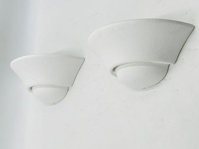 Pair of Modern White Ceramic Wall Sconces. Sleek and minimal pair of white ceramic wall sconces 
