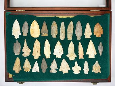 Vintage Frame of Arrowheads. Flaked stone projectile points in a range of shapes including 