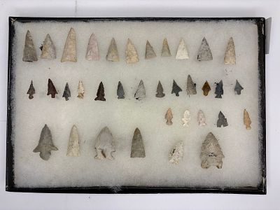 Frame of Bird Points. Assortment of bird points made from various stone types with colors 