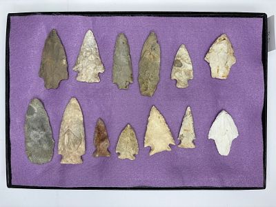 Nice Frame of MO Arrowheads. Assortment of knapped stone projectile points featuring triangular 
