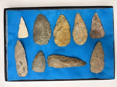 Frame of 9 Blades from SW MO. Nine flaked stone blades with colors ranging from light tan to 