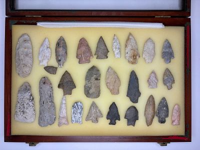 Vintage Frame of Mixed Arrowheads. Assortment of mixed flaked-stone arrowheads and projectile 