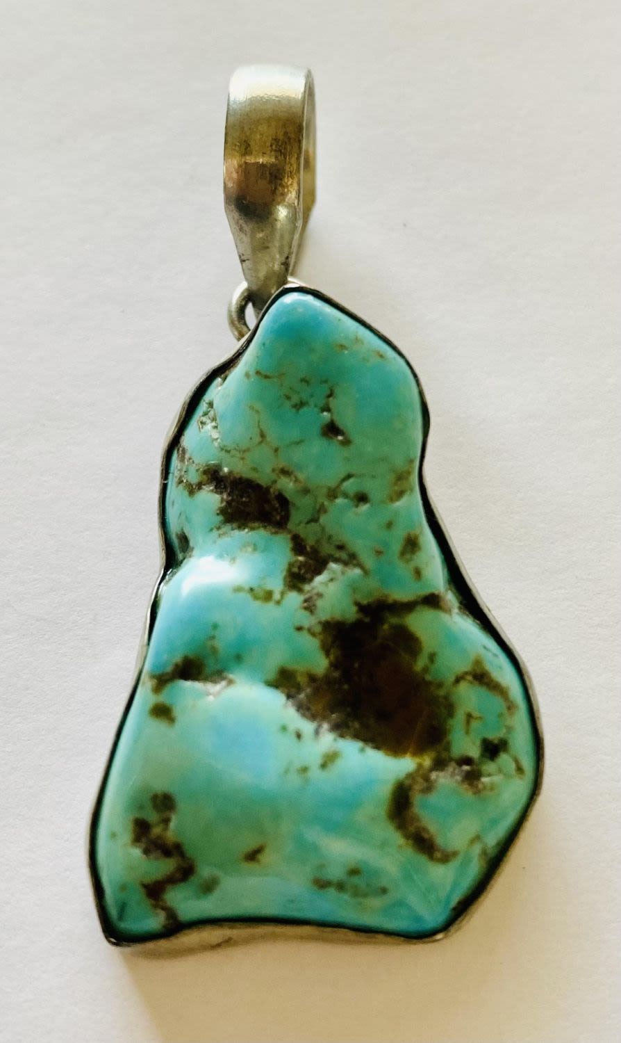 Lot 172: Turquoise sterling pendant nugget