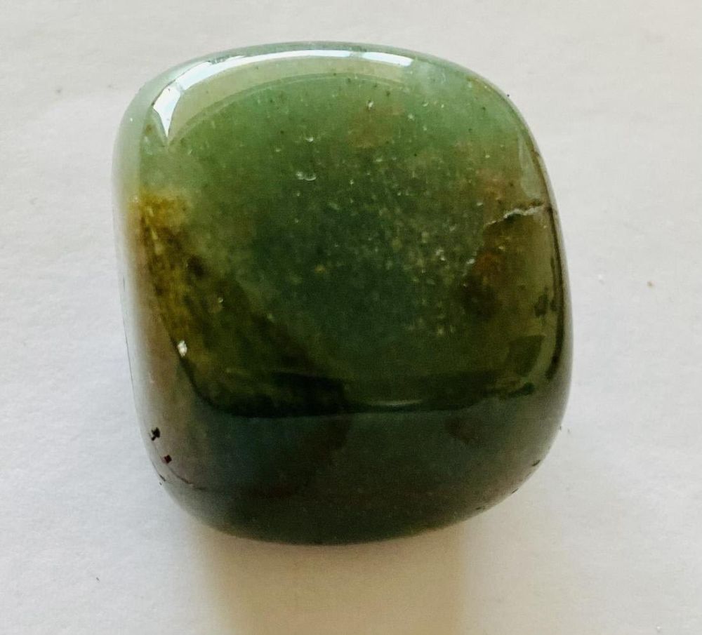 Lot 179: Polished green stone- cube