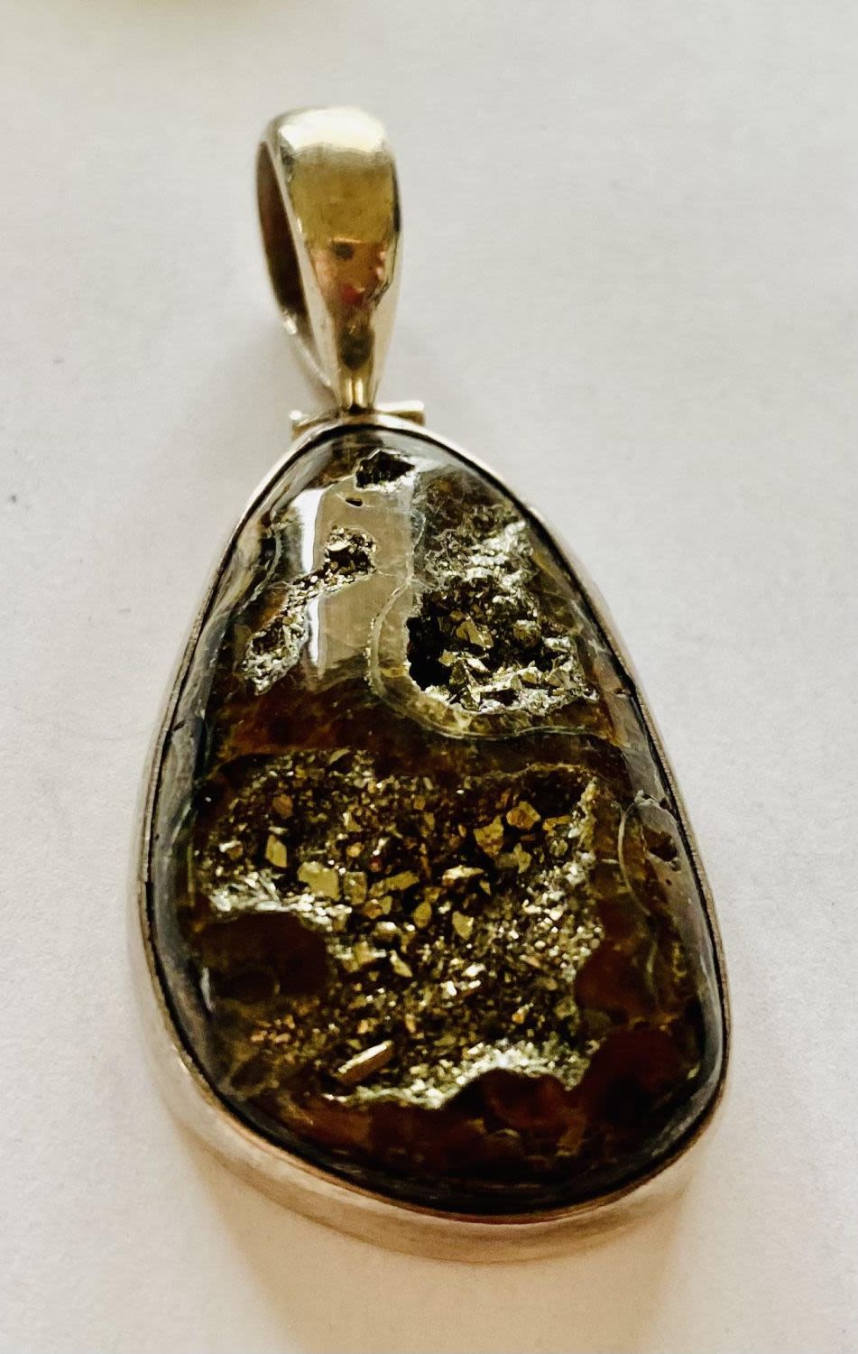 Lot 194: Sterling pyritized ammonite pendant