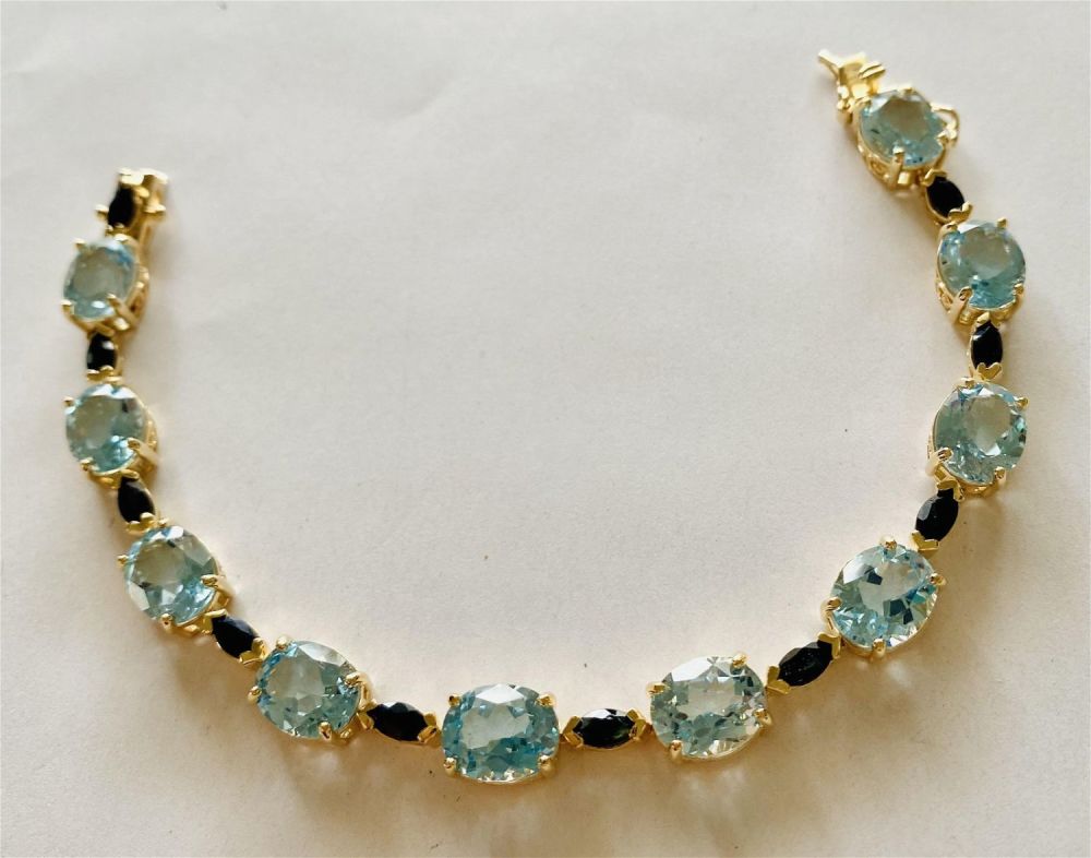 Lot 217: Blue topaz sapphire vermeil bracelet