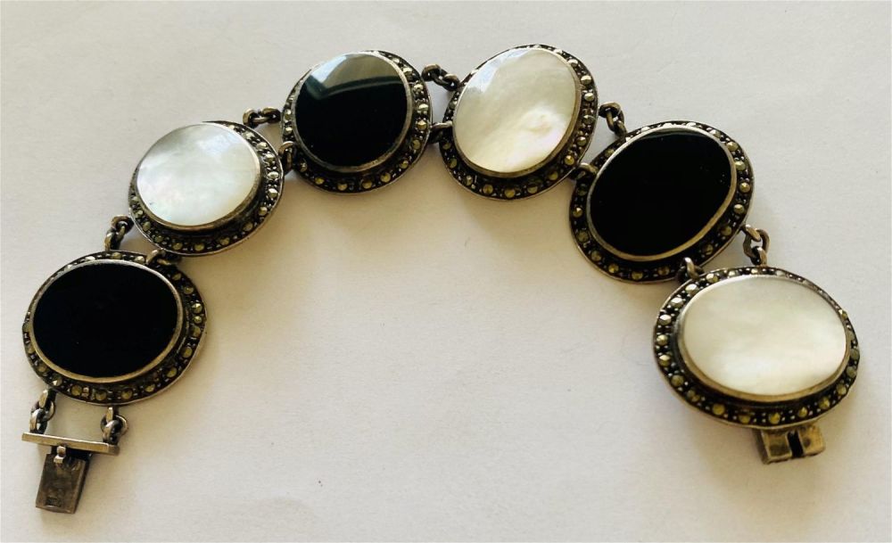 Lot 246: Onyx mother of pearl marcasite sterling bracelet