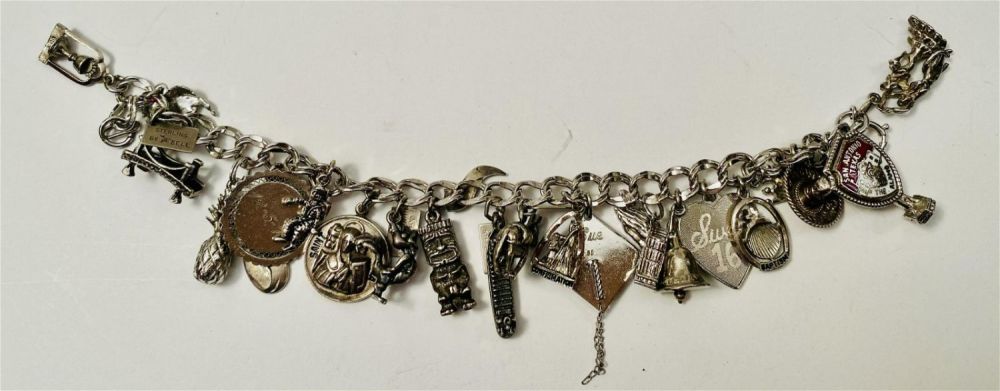 Lot 258: Vintage sterling charm braclet - 20 plus charms