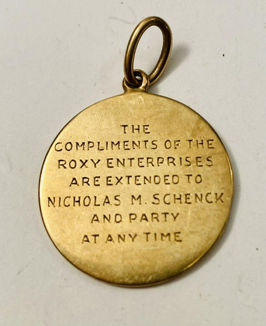 Lot 261: Gold presentation charm pendant