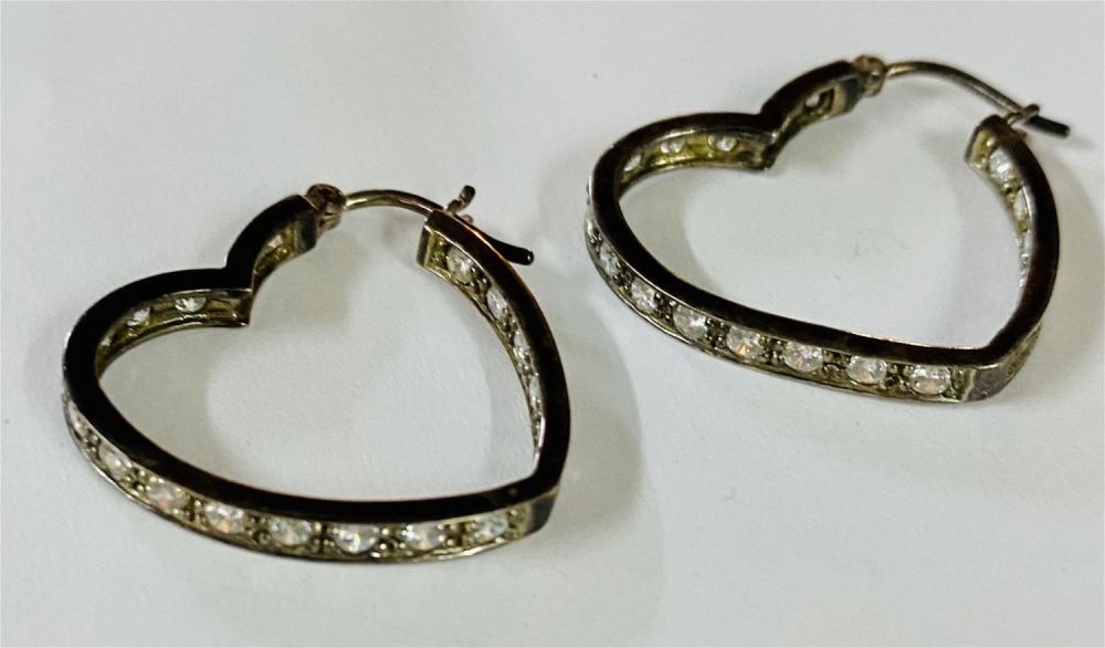 Lot 474: Heart hoop earrings clear stones