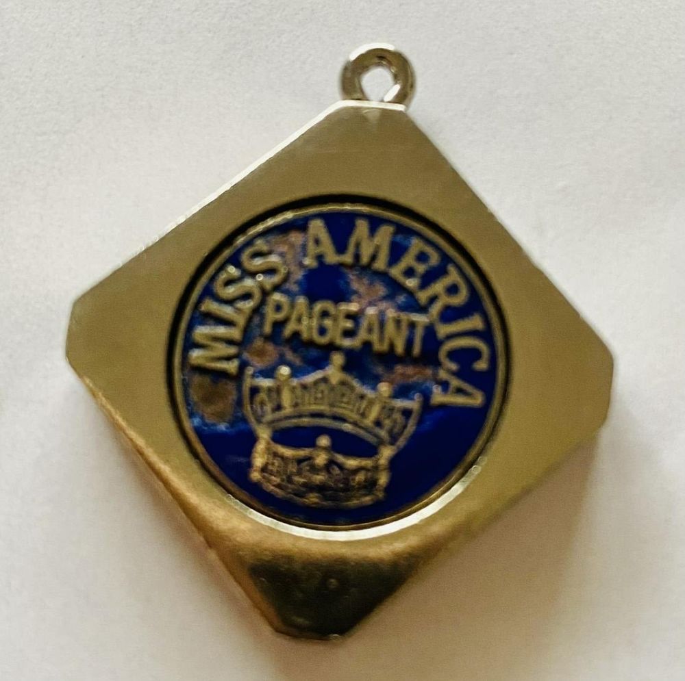 Lot 379: Miss American Pageant charm