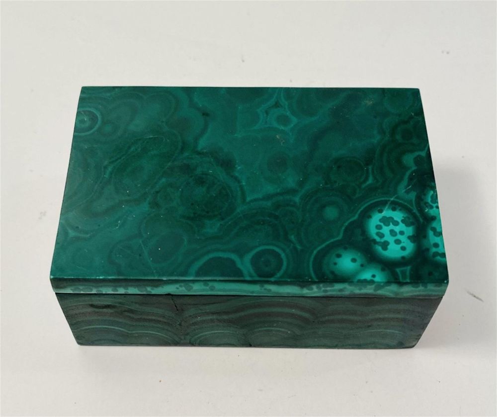 Lot 428: Malachite covered box/dresser