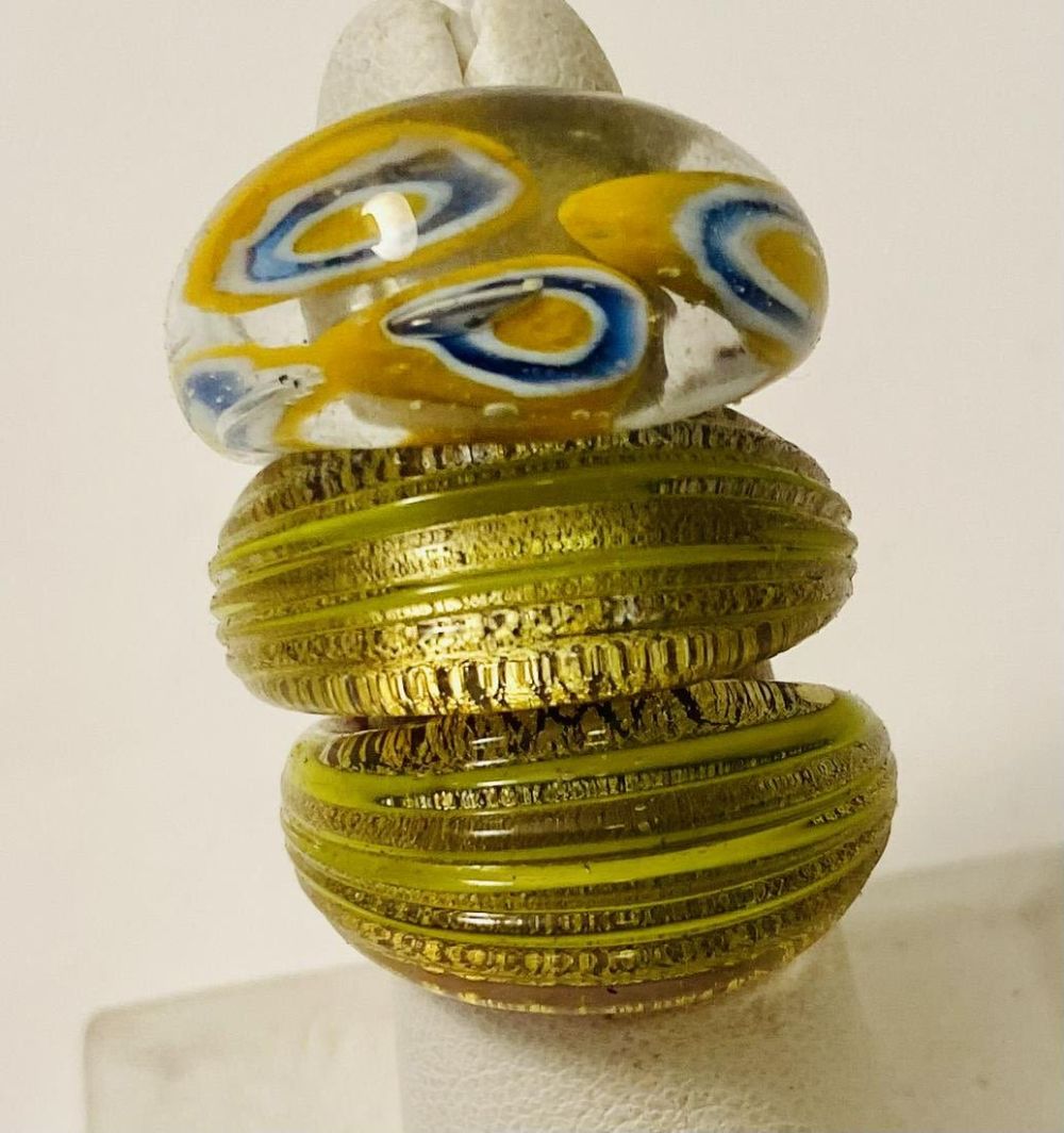 Lot 175: Glass rings - three rings
