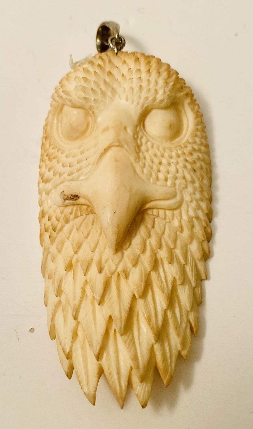 Lot 187: Bone carved eagle face /head