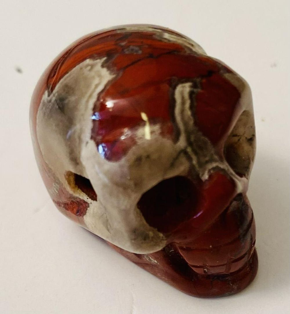 Lot 249: Jasper carved drilled skull
