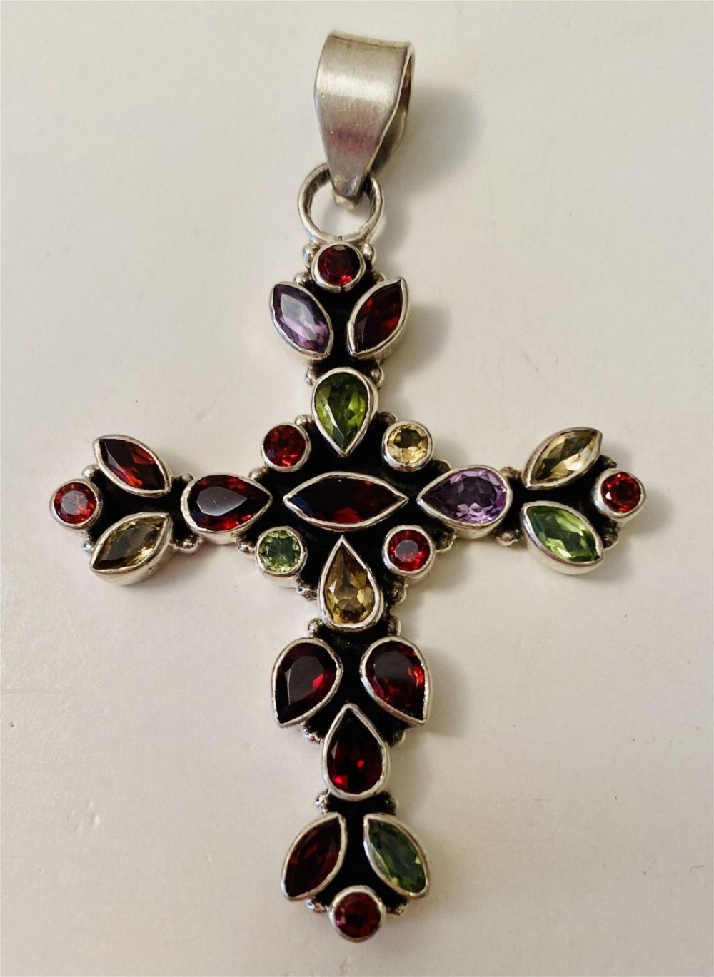 Lot 252: Gemstone cross sterling pendant