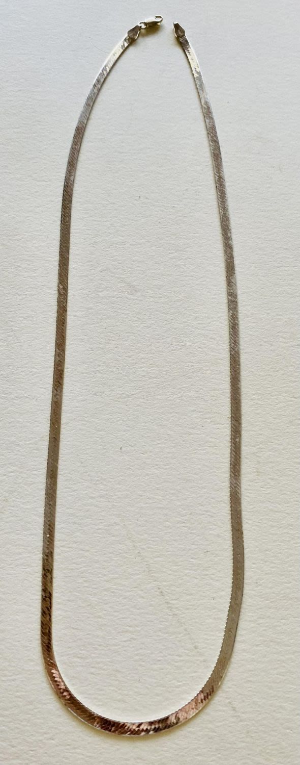 Lot 319: Sterling 18 inch herringbone chain