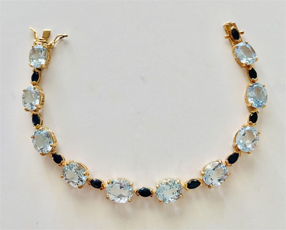 Lot 327: Blue topaz sapphire vermeil braclet