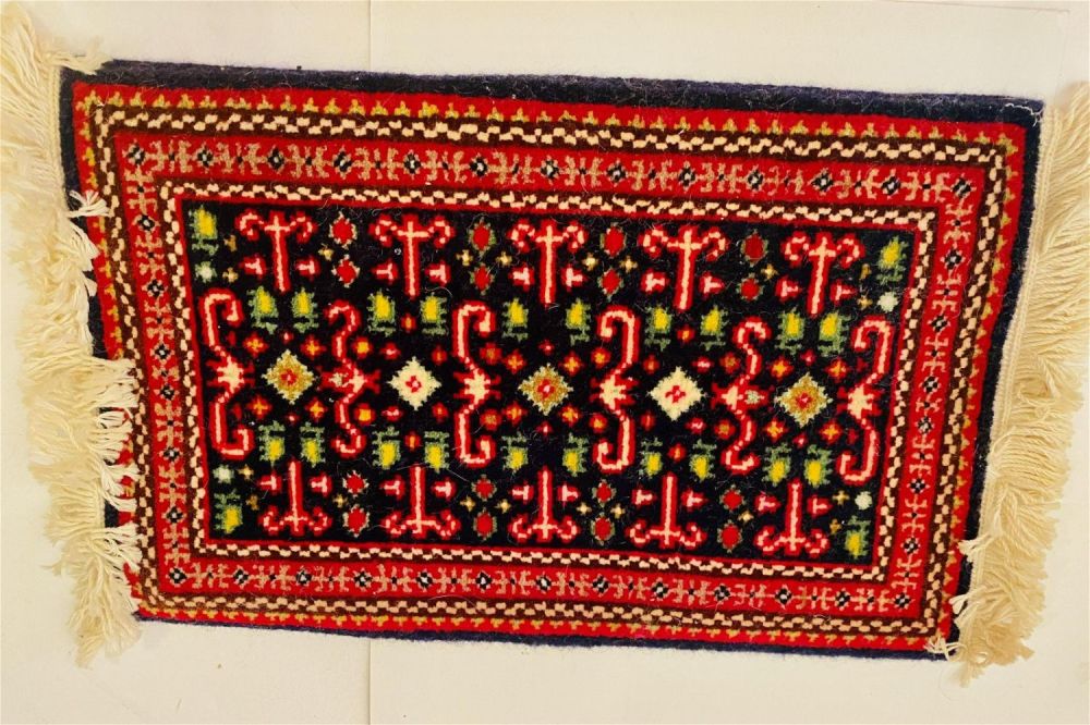 Lot 332: Sample oriental rug red background