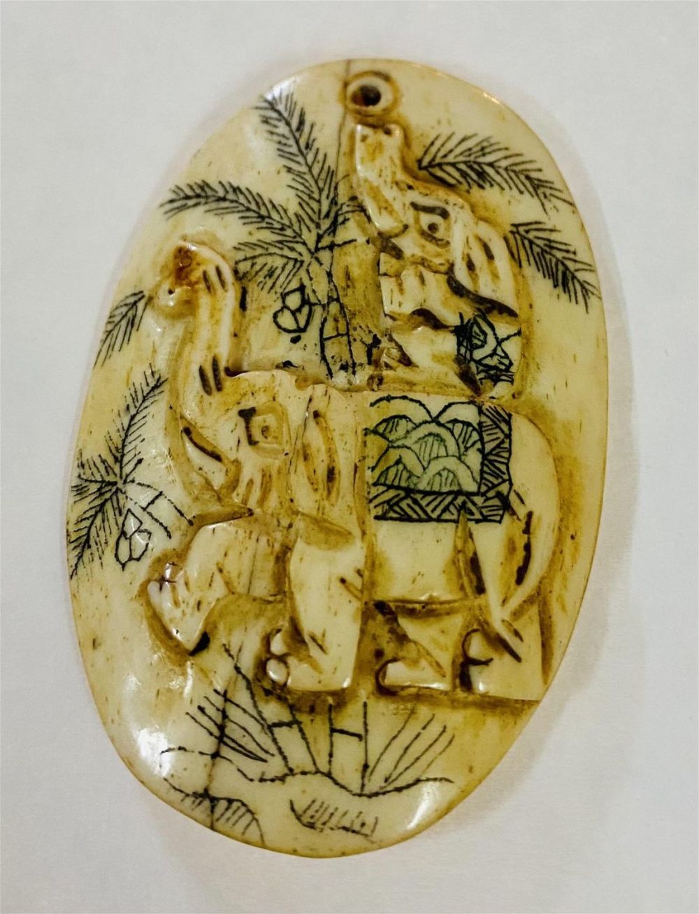 Lot 402: Oval carved elephant plaque