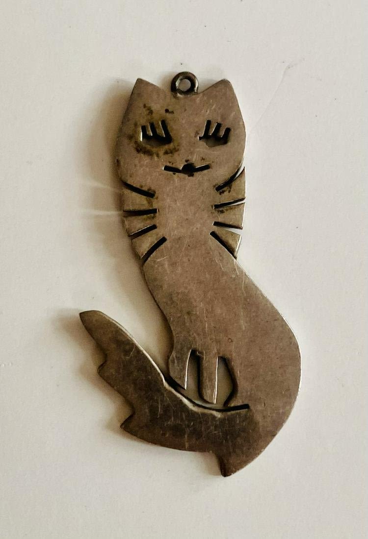 Lot 450: Sterling Mexican cat with big eyelashes