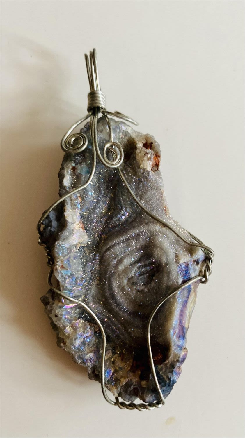 Lot 453: Custom wire wrapped mineral druzy pendant