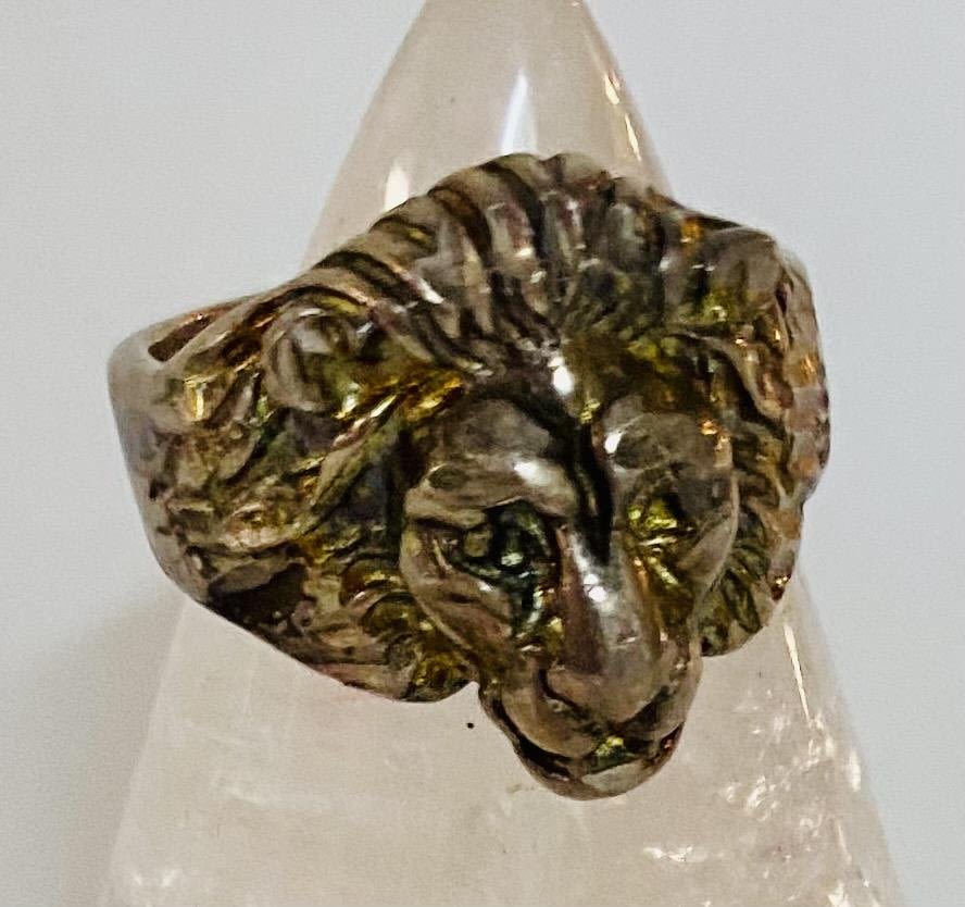 Lot 158: Sterling lion head old ring