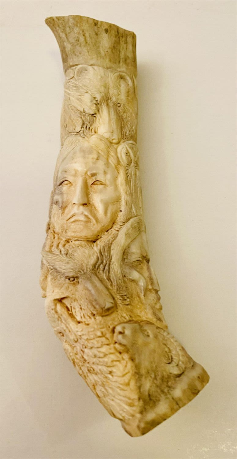 Lot 164: Carved antler Indians, eagles, bear carved 360 degrees