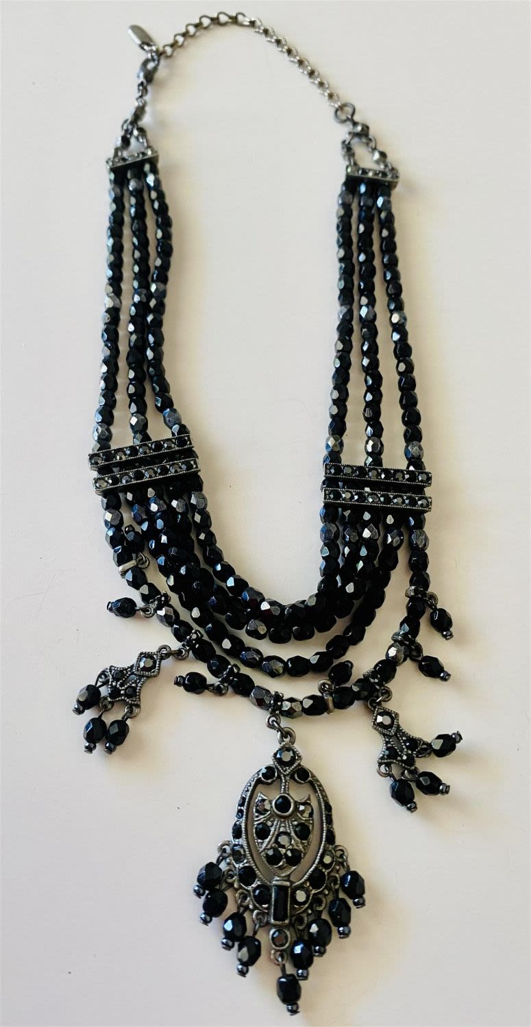 Lot 175: Multi strand black bead necklace