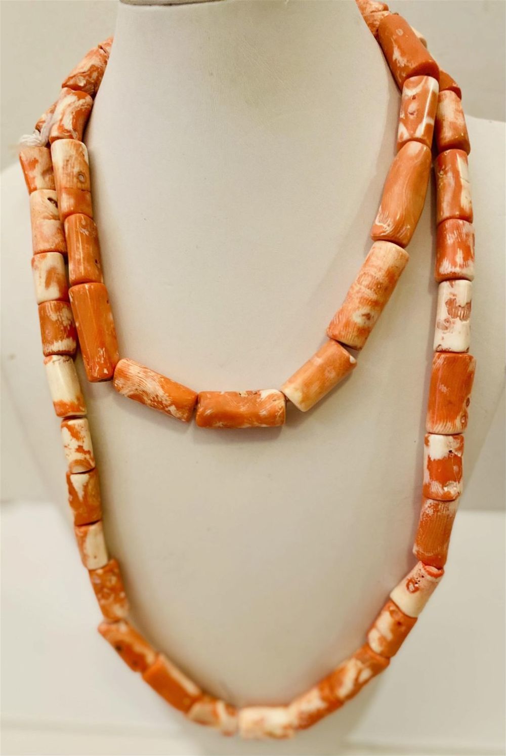 Lot 176: Coral long strand beads