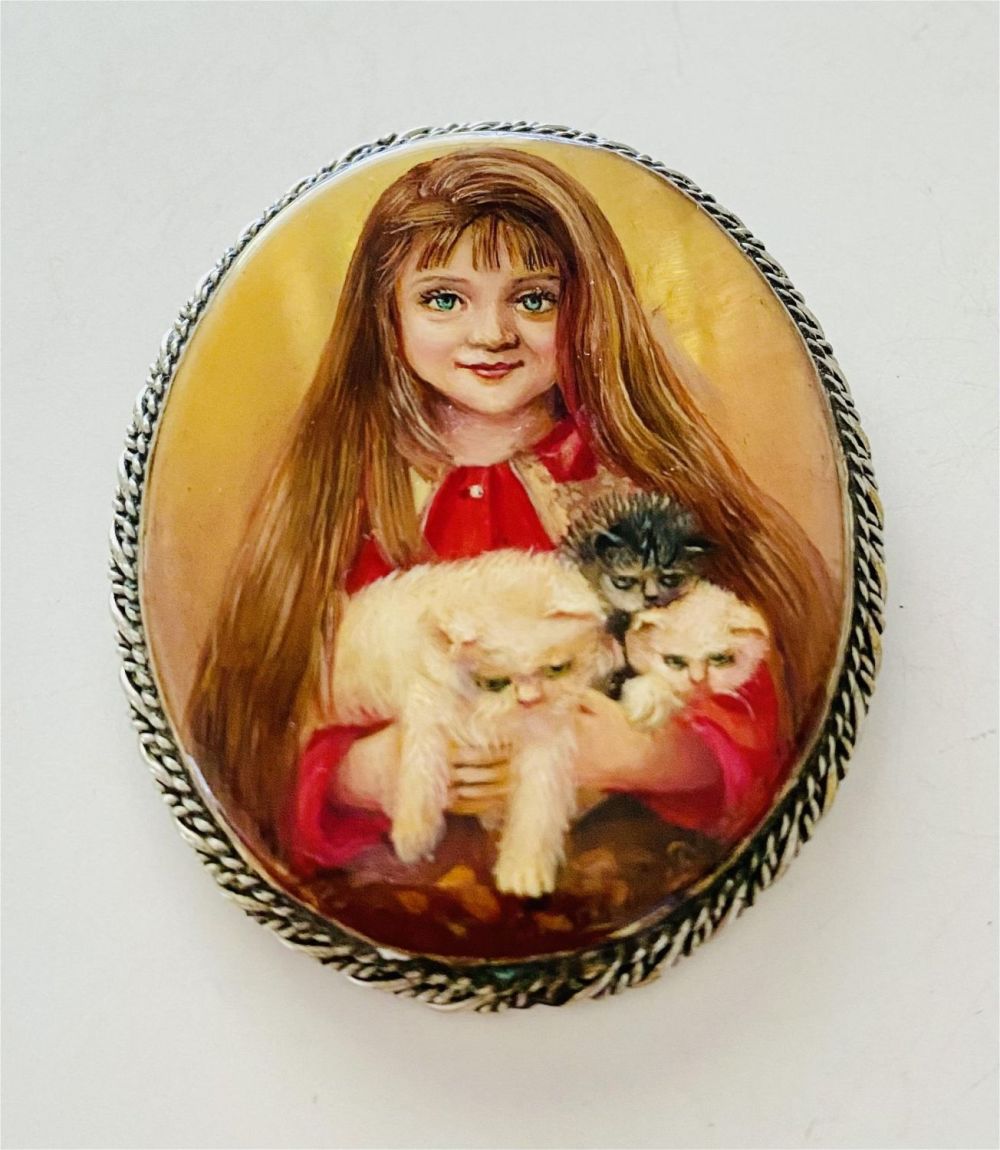 Lot 213: Russian hand painted pin girl/cat signed