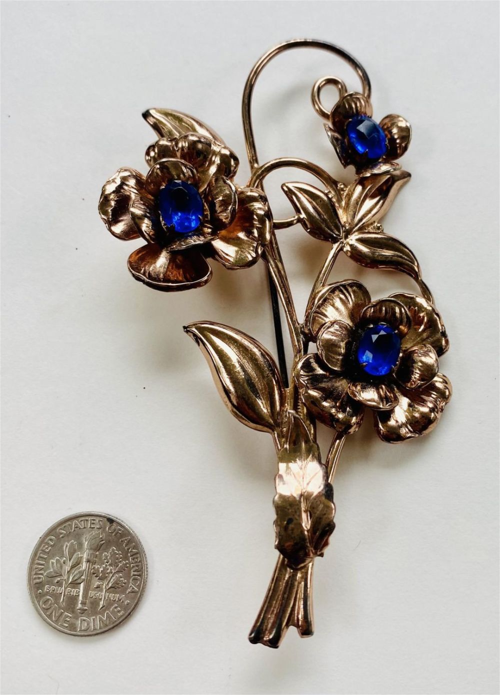 Lot 241: Sterling deco flower pin with blue stones