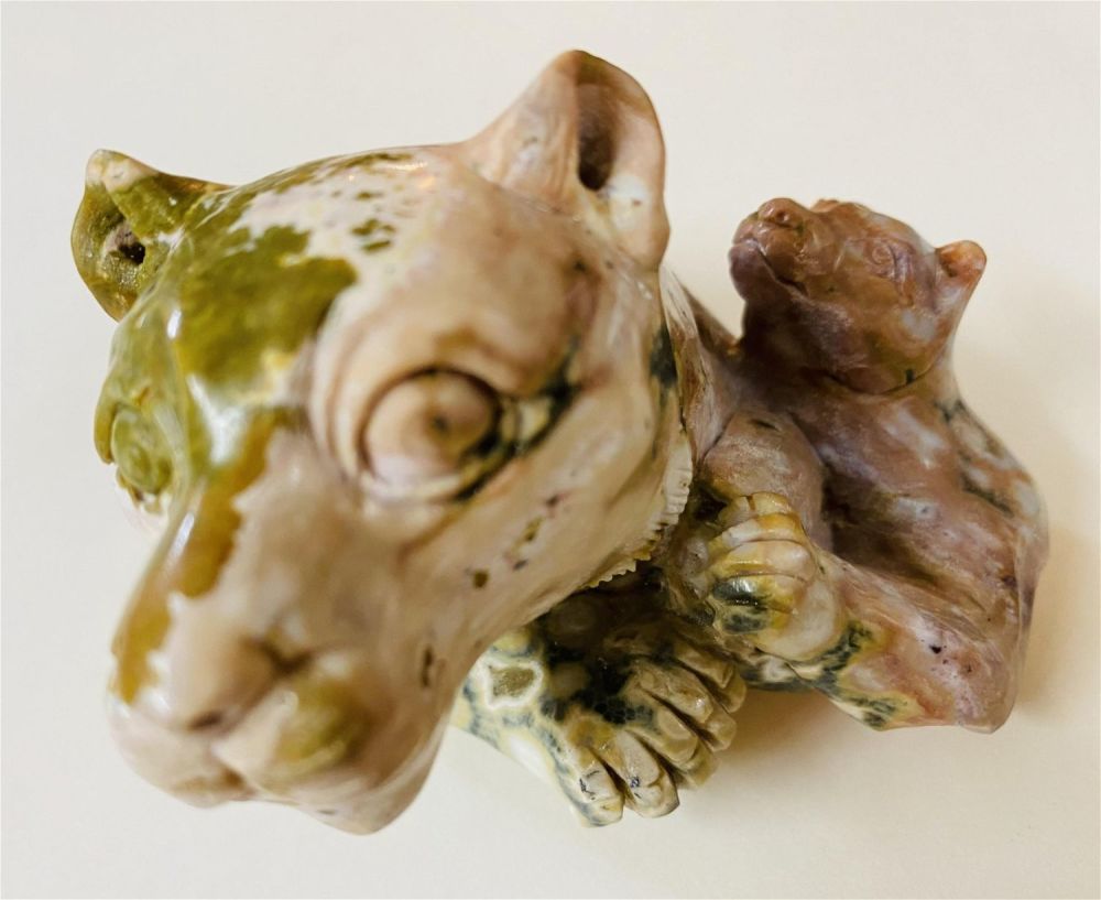 Lot 311: Carved tiger cat/baby statue