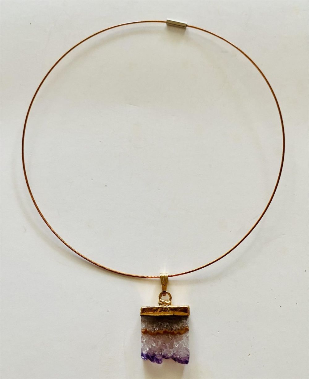 Lot 323: Amethyst sliced crystal pendant