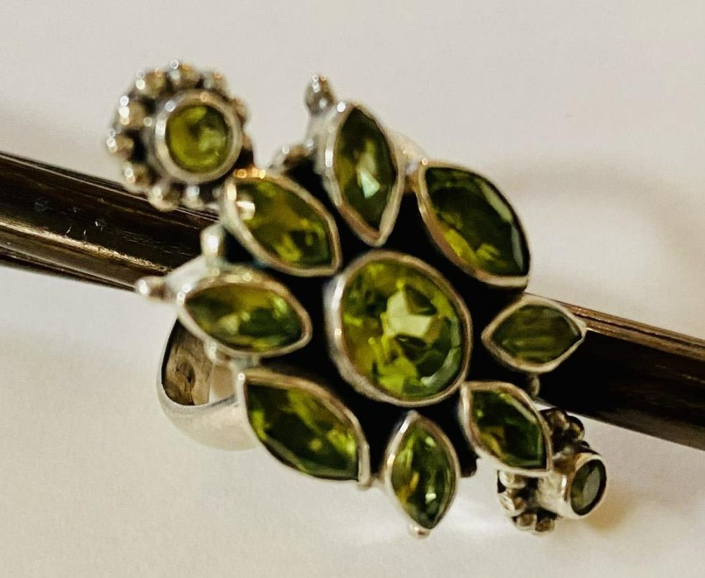 Lot 155: Peridot cocktil sterling ring